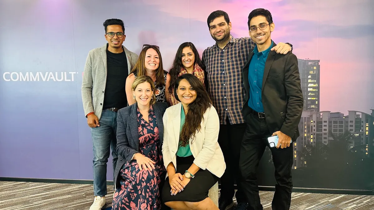 Members of the Commvault legal team, including Chief Legal and Compliance Officer Danielle Sheer, standing next to each other.