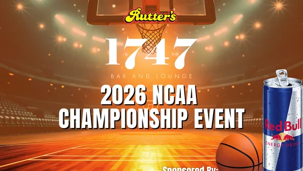 A photo of an empty basketball court surrounded by tiers of seating. Text over top of the image says "Rutter's 1747 Bar and Lounge 2026 NCAA Championship Event sponsored by Red Bull Energy Drink."