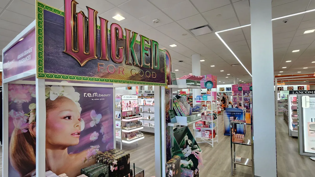 Cosmetics display of Wicked products, with shelves of other cosmetics in the background.