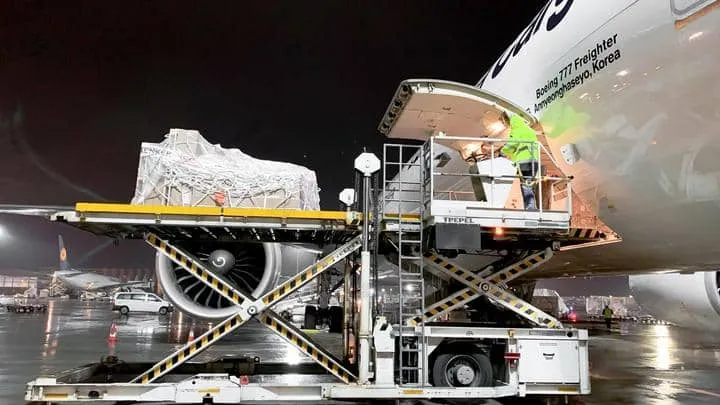 Cargo is being loaded onto a 777 freighter aircraft