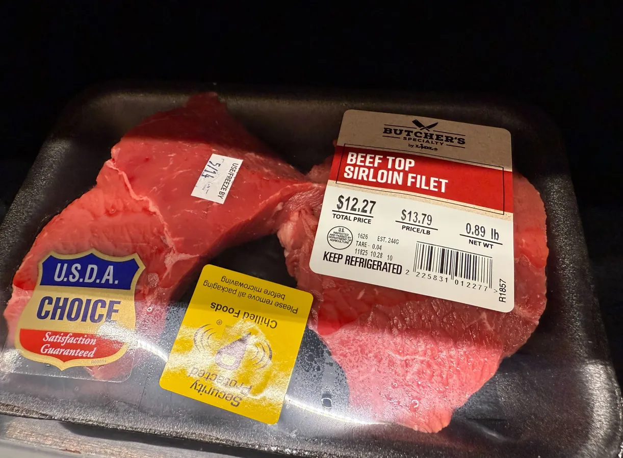 Beef in a shrink-wrapped package.
