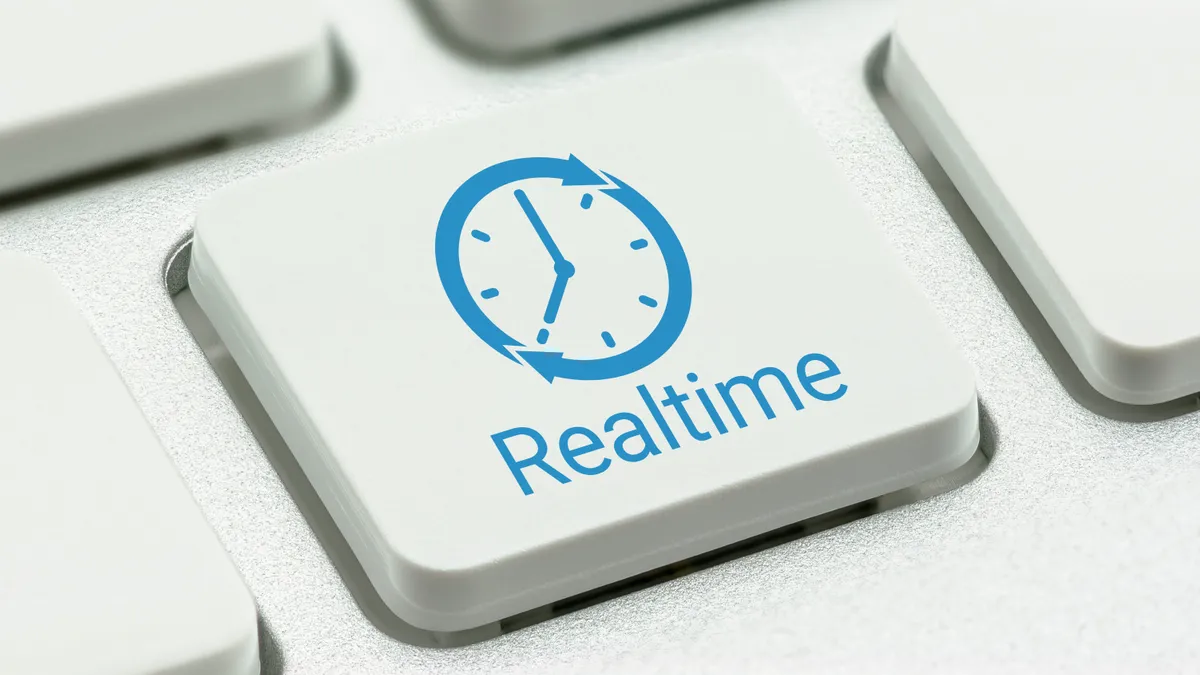 Button on a keyboard that says 'real-time'