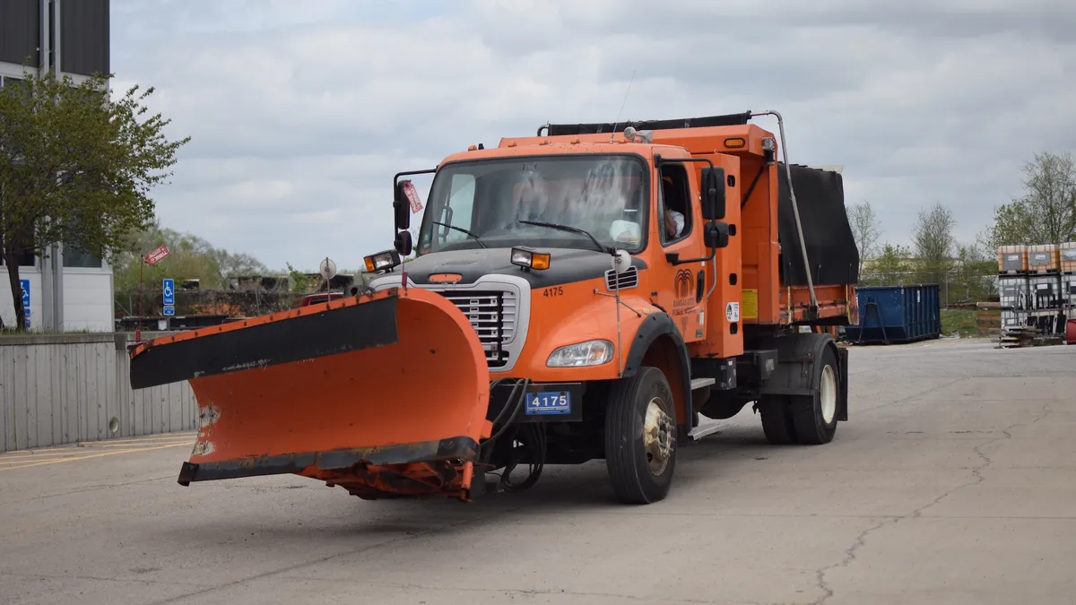 Orange waste truck