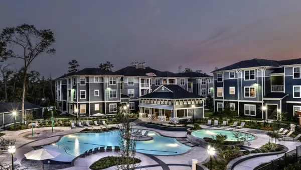 A pool between three-level apartments