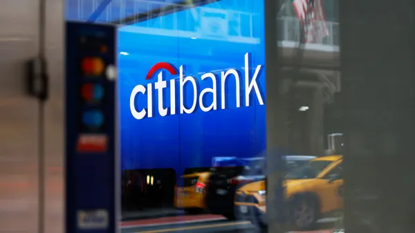 A closeup of Citi signage on a city storefront