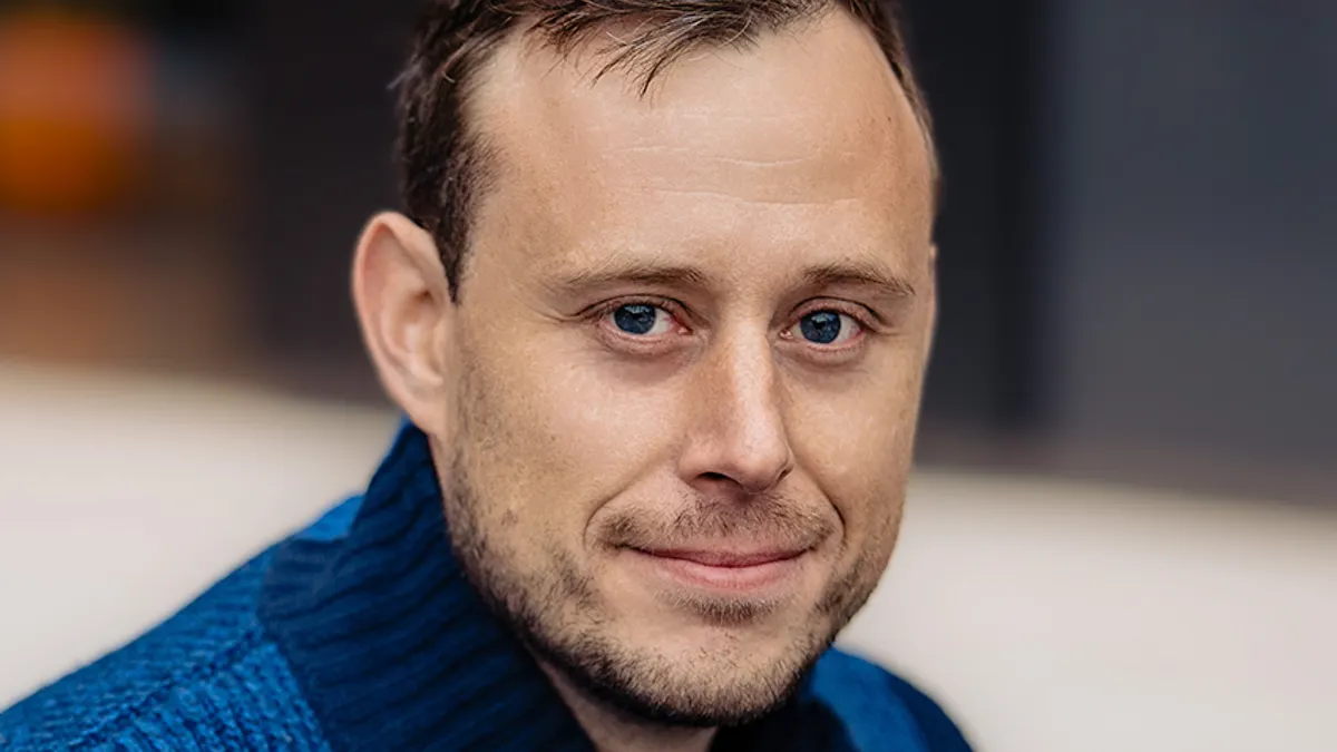 A portrait of James Lazarovits at Archon Biosciences.
