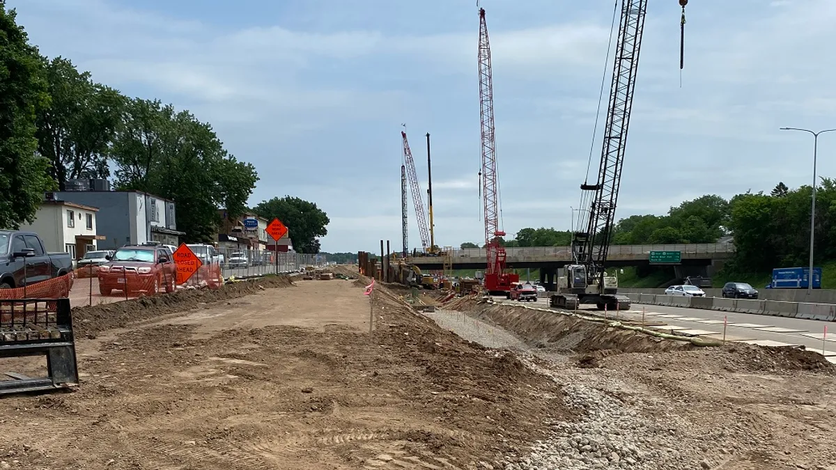 Construction ongoing on a busy road