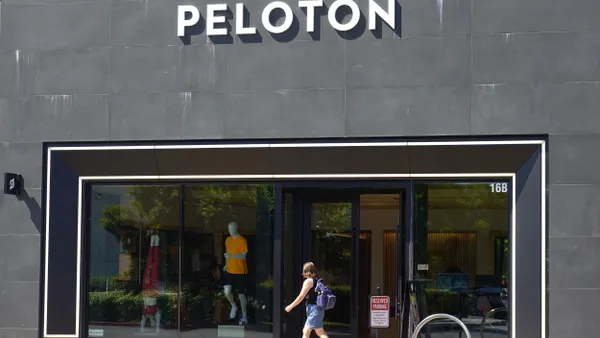 A pedestrian walks by a Peloton store on May 08, 2024 in Palo Alto, California.