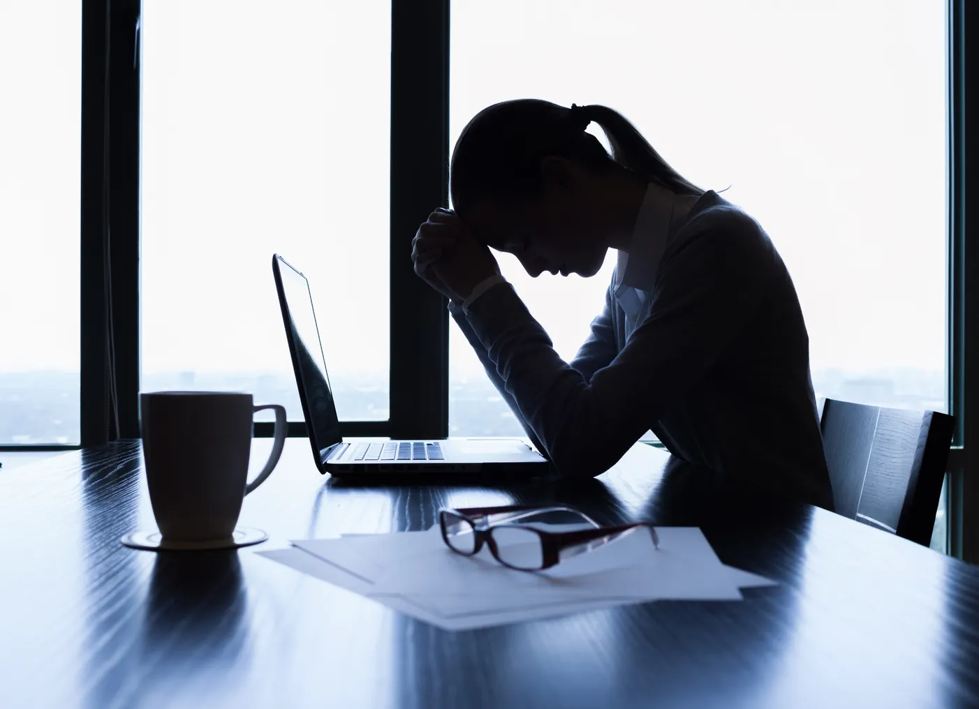 Stressed businesswoman at desk