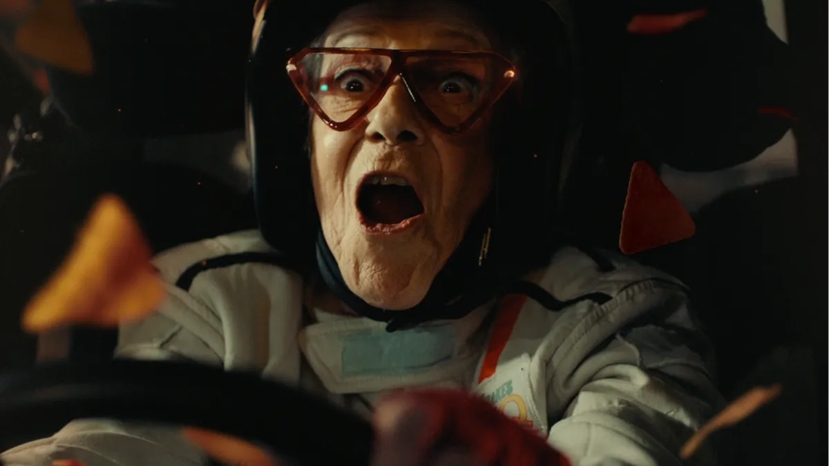 A grandmother drives a monster truck in a Doritos ad