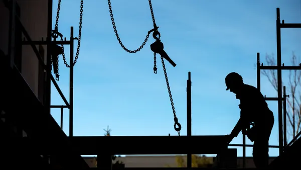 A lone construction worker on a jobsite.