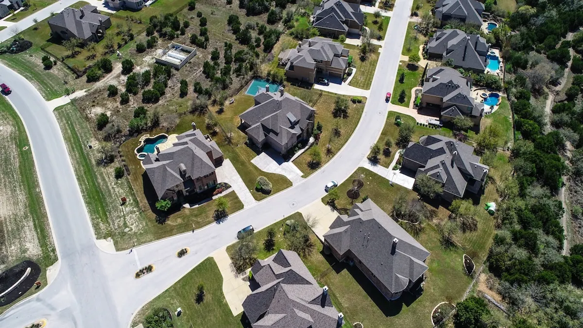 Suburb in Dripping Springs , Texas , USA aerial drone view above homes and houses in neighborhood