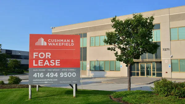 A Cushman & Wakefield signboard in Markham, Ontario, Canada.