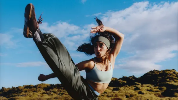 Martial artist Jewelianna Ramos-Ortiz does a high kick in Iceland for the new fall campaign for Athleta.