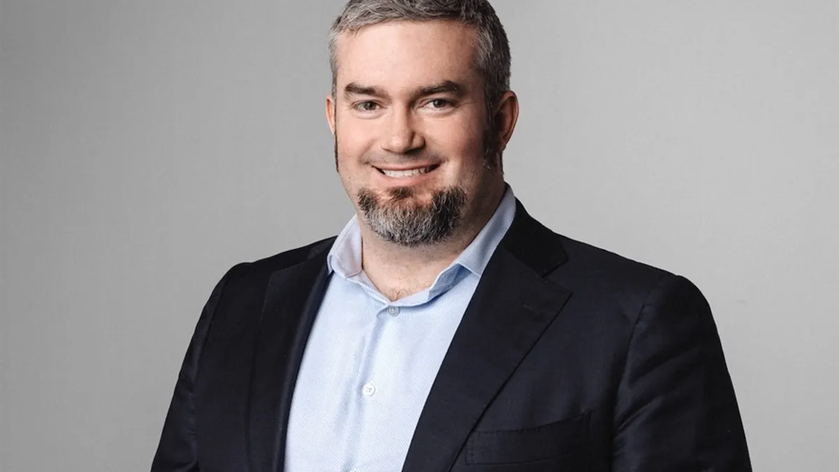 crypto bank anchorage digital ceo nathan mccauley smiling in a suit