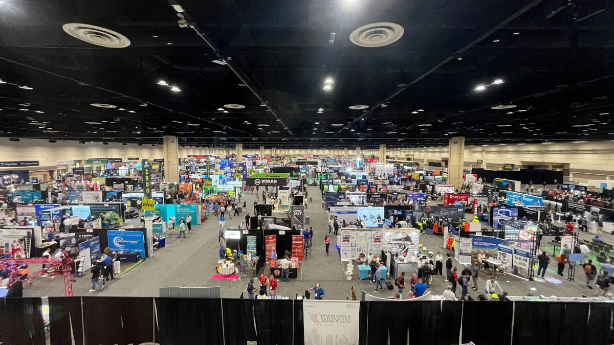 An overhead view of an expo hall floor at a conference.