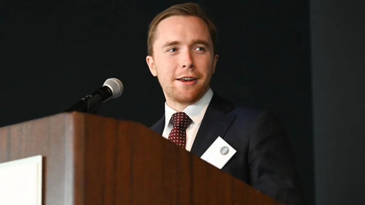 Jack Terschluse, head of legal at Balto, speaking at a podium