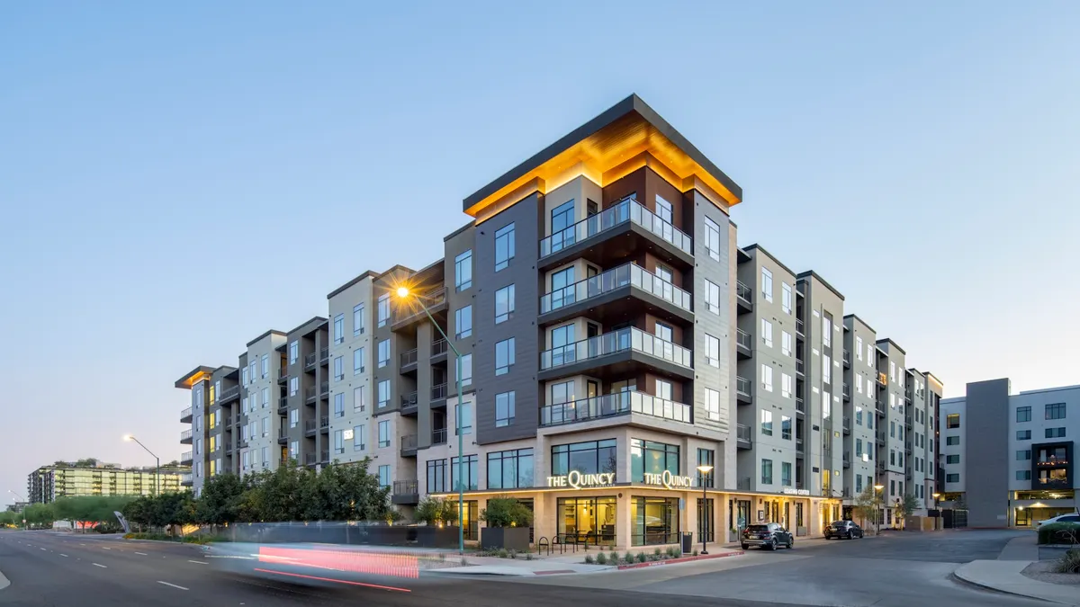 Modern mid-rise apartment building with glass