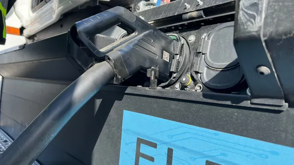 A Freightliner eCascadia is plugged into a fast-charging dispenser at Forum Mobility's FM Harbor site in Long Beach.