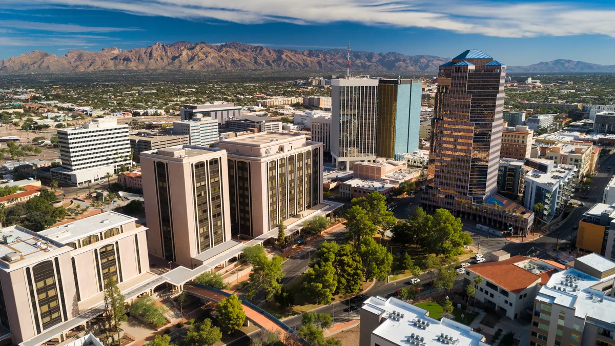 An aerial view of a city with some arid mountains in the background.