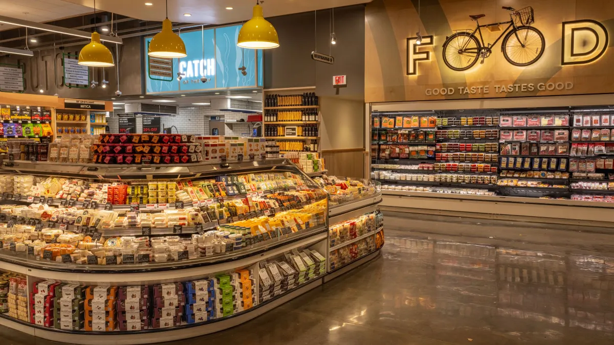 Interior shot of a grocery store cheese section
