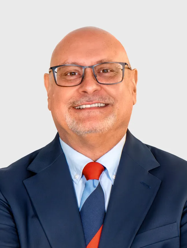 Headshot of a man in a suit.