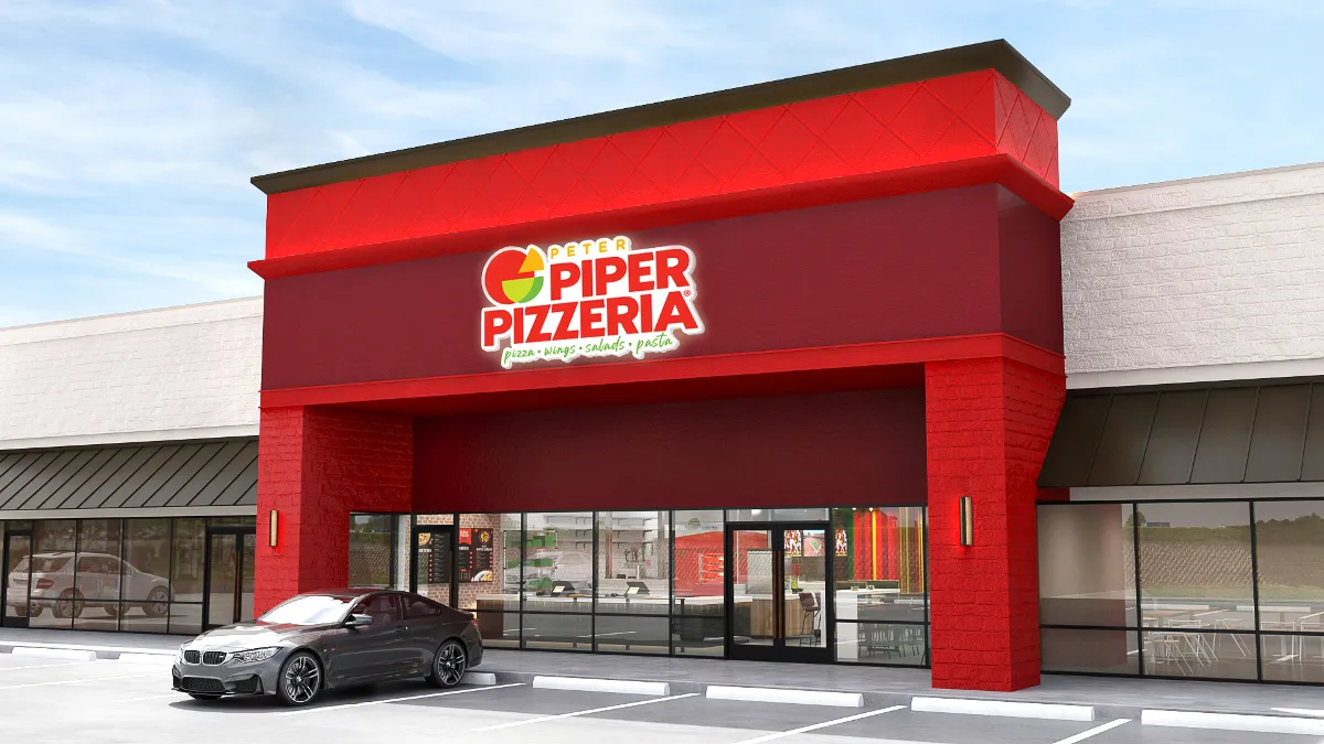 An image of a red building with Peter Piper Pizzeria branding