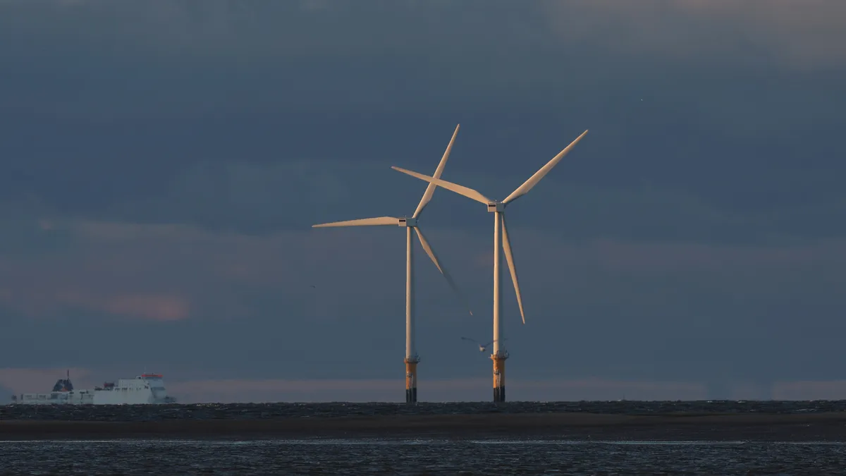 Wind turbines generate electricity at Burno Bank Off Shore Wind Farm on December 07, 2022 in Liverpool, England. UK