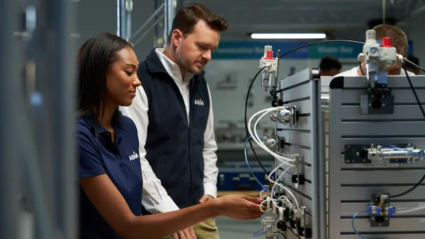 Workers collaborate at ABM's technical training center in Boise, Idaho.