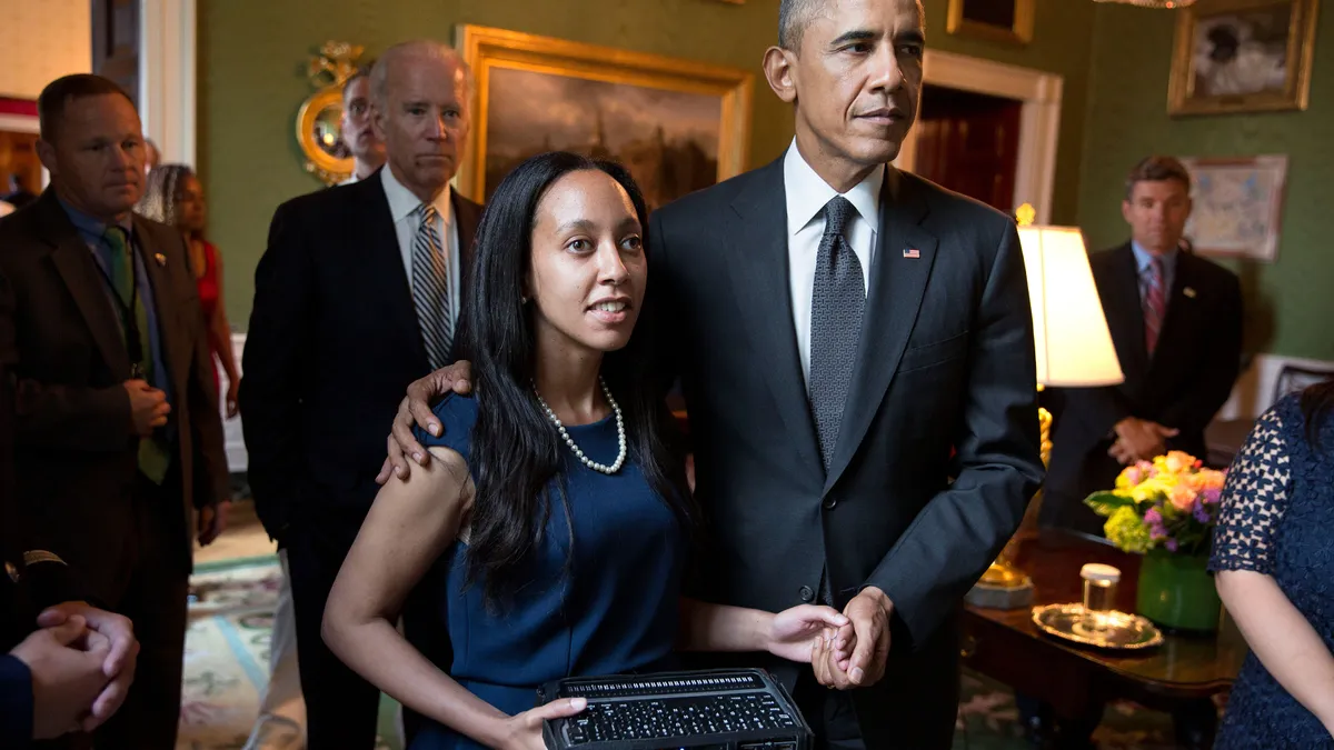 Photo of President Barack Obama with disability rights advocate Haben Girma.