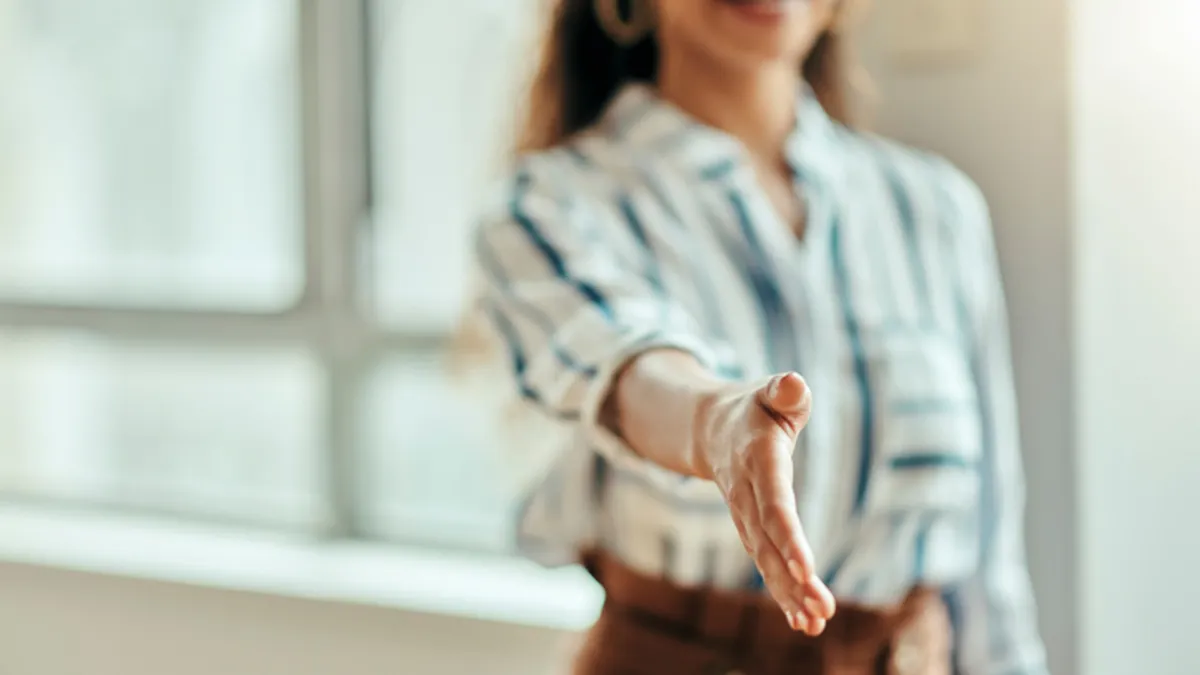 woman offering handshake