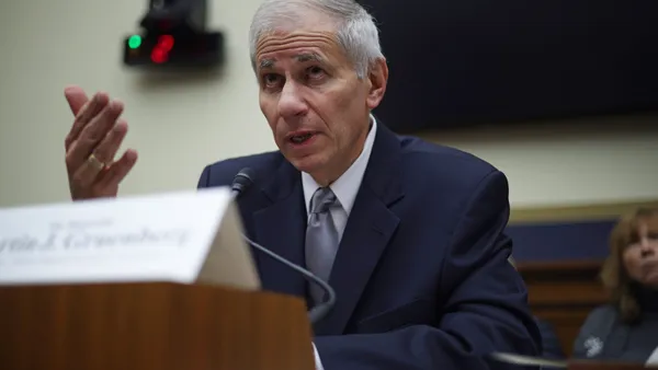 Martin Gruenberg, who leads the Federal Deposit Insurance Corp., talks to legislators during a Congressional hearing.