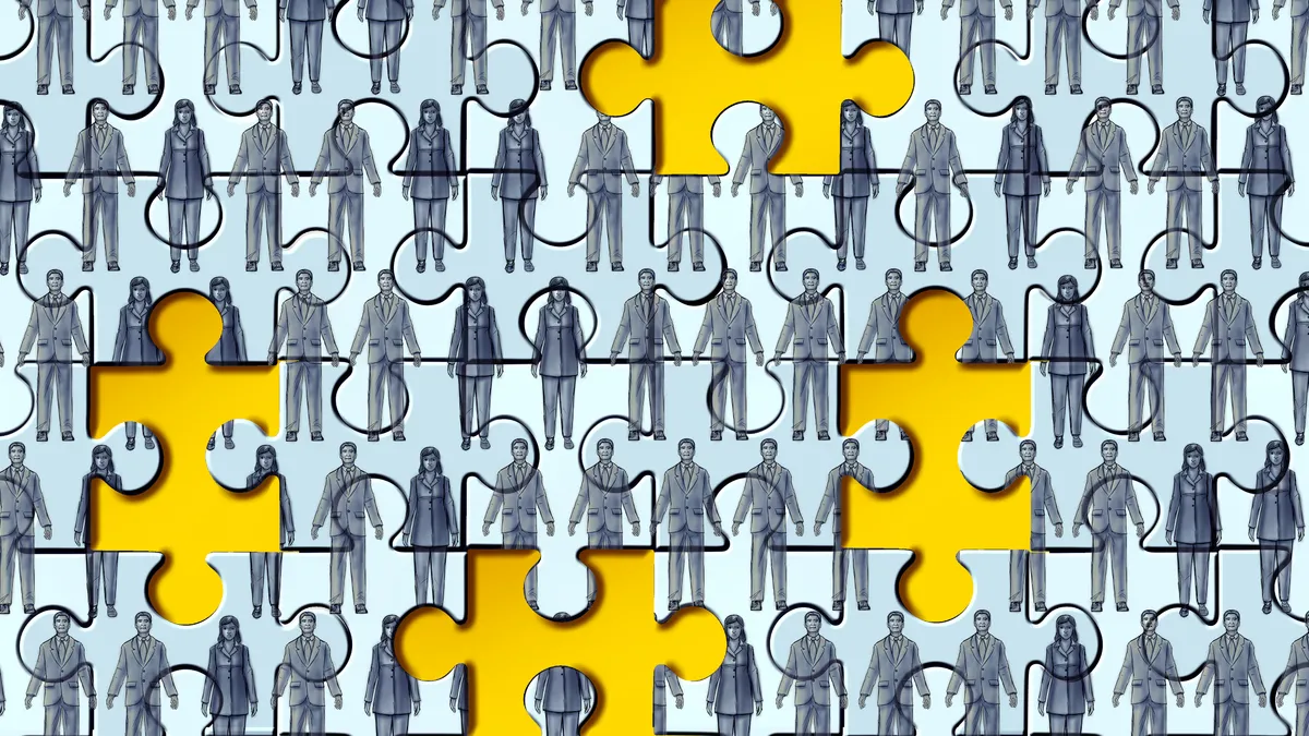 A light blue puzzle depicting rows of workers has scattered pieces missing, showing a yellow background underneath.