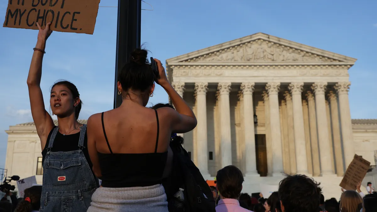 A pro-choice activist holds up a sign during a rally in front of the U.S. Supreme Court