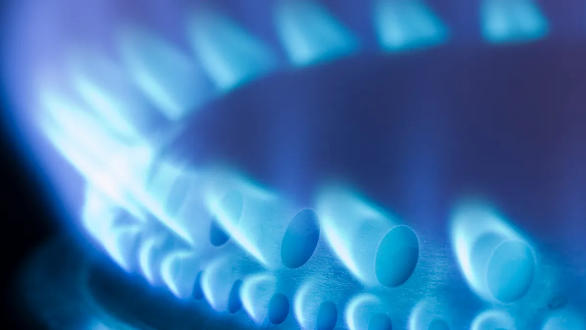 Blue flames of a gas stove stock photo