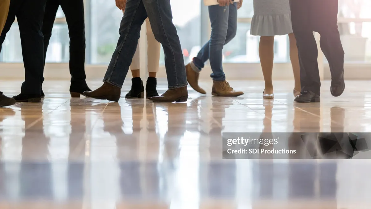 People walking on an office floor