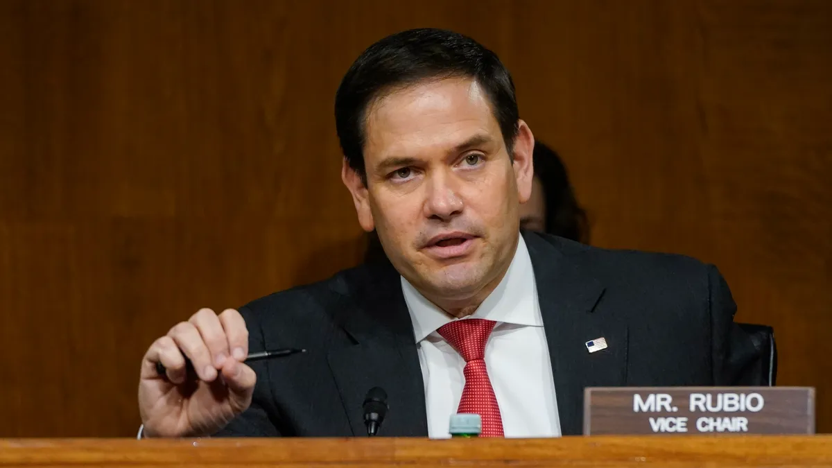 Sen. Marco Rubio sits at a senate conference.