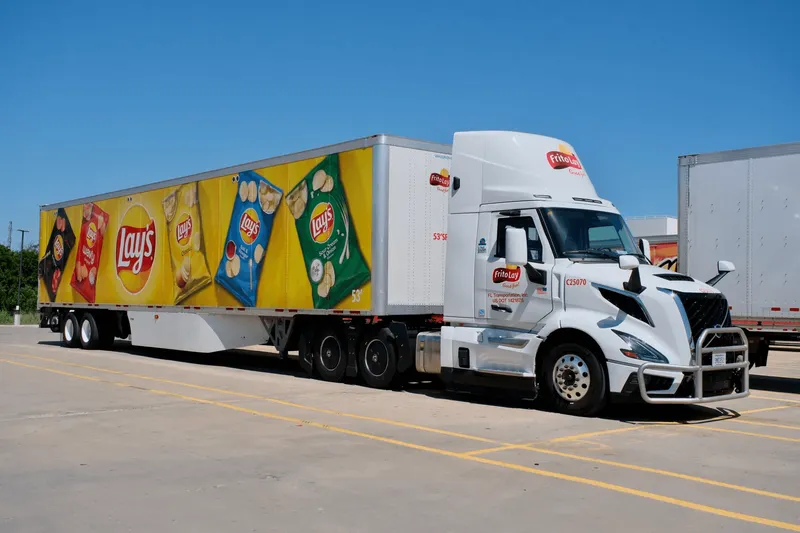 A Frito-Lay biodiesel tractor-trailer in a parking area.