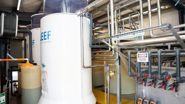 A tank of PFAS-containing liquid sits in a facility