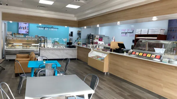 An image of a restaurant with tables that showcases a pretzel, ice cream and cookie concept.