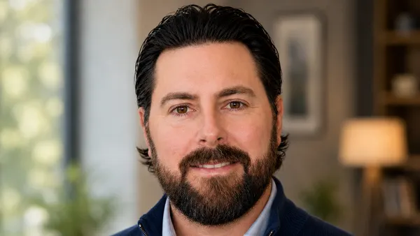 headshot of a bearded man