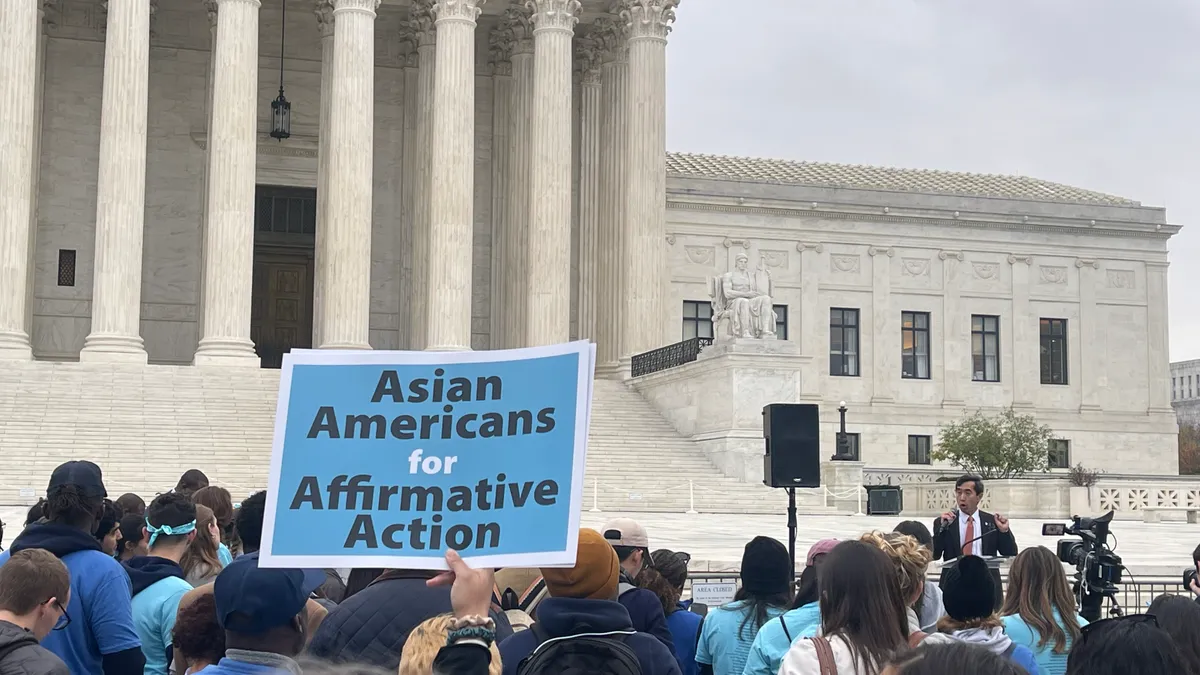 Protesters gather outside of the U.S. Supreme Court building to urge justices to preserve race-conscious admissions.