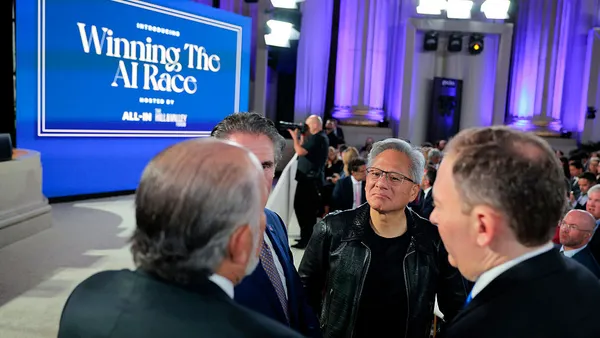 Tech executive Jensen Huang speaks to Trump administration officials at artificial intelligence event
