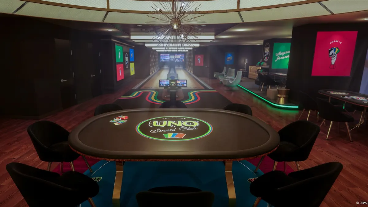 A hotel suite with Uno-themed decor. A game table is featured prominently in the foreground.