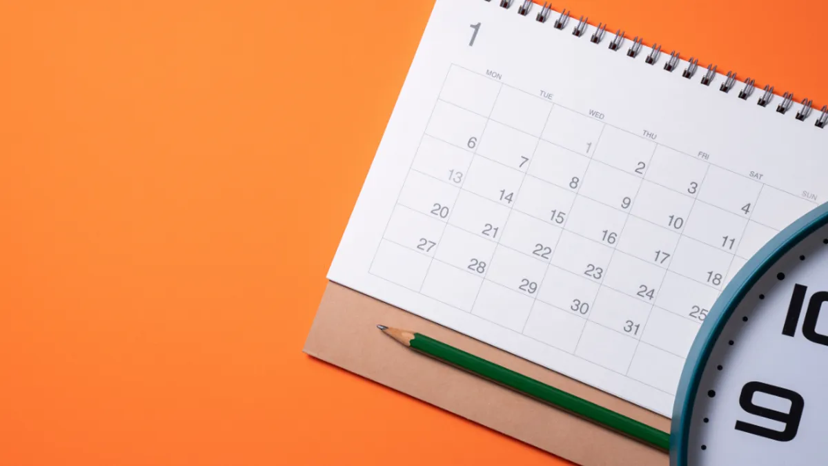 Calendar pencil on orange background