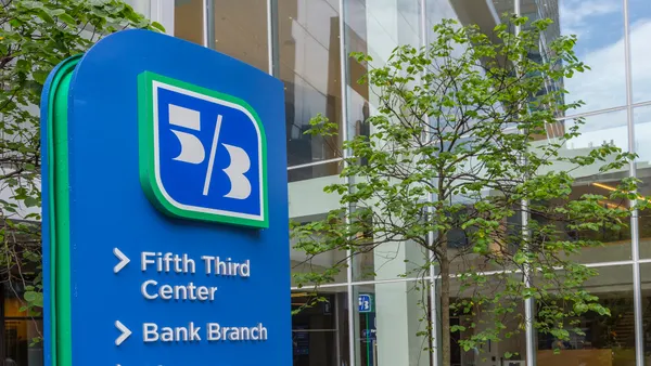 A Fifth Third Bank sign shows "5/3" with the words "Fifth Third Center" and "Bank Branch" below.