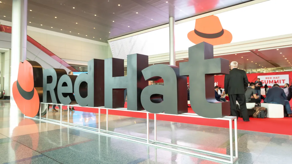 Red Hat company logo in lobby of corporate headquarters.