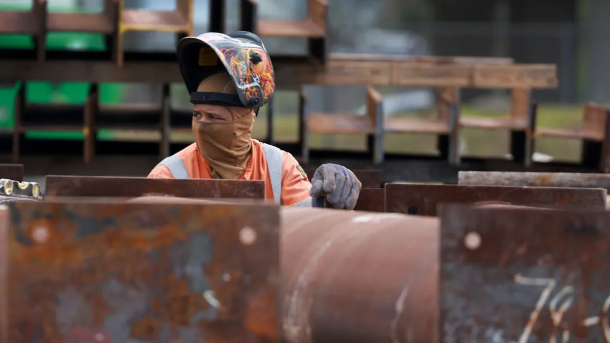 A construction worker helps build the Signature Bridge on January 5, 2024, in Miami, Florida.