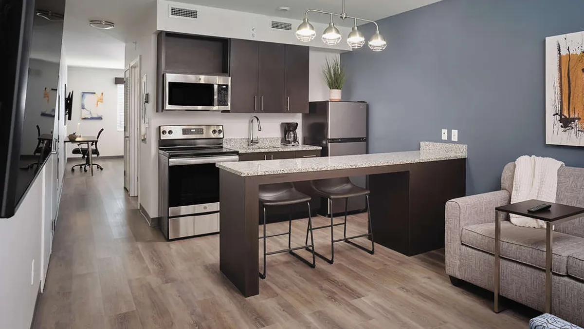 The interior of an apartment-style hotel room at a StayApt Suites hotel.