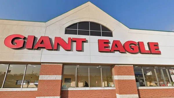 Exterior of a supermarket with a sign that reads "Giant Eagle" in red.